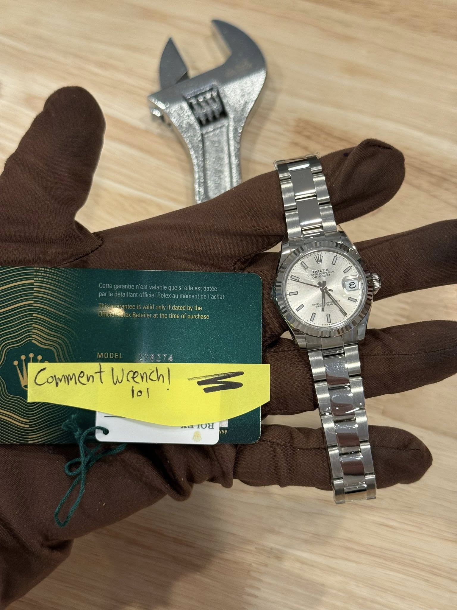 May be an image of wrist watch and text