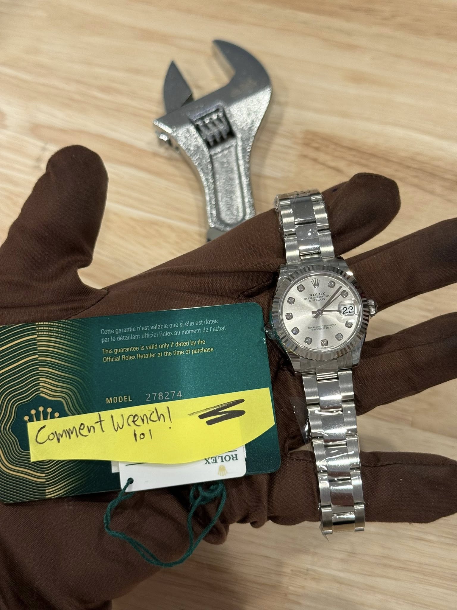 May be an image of wrist watch and text
