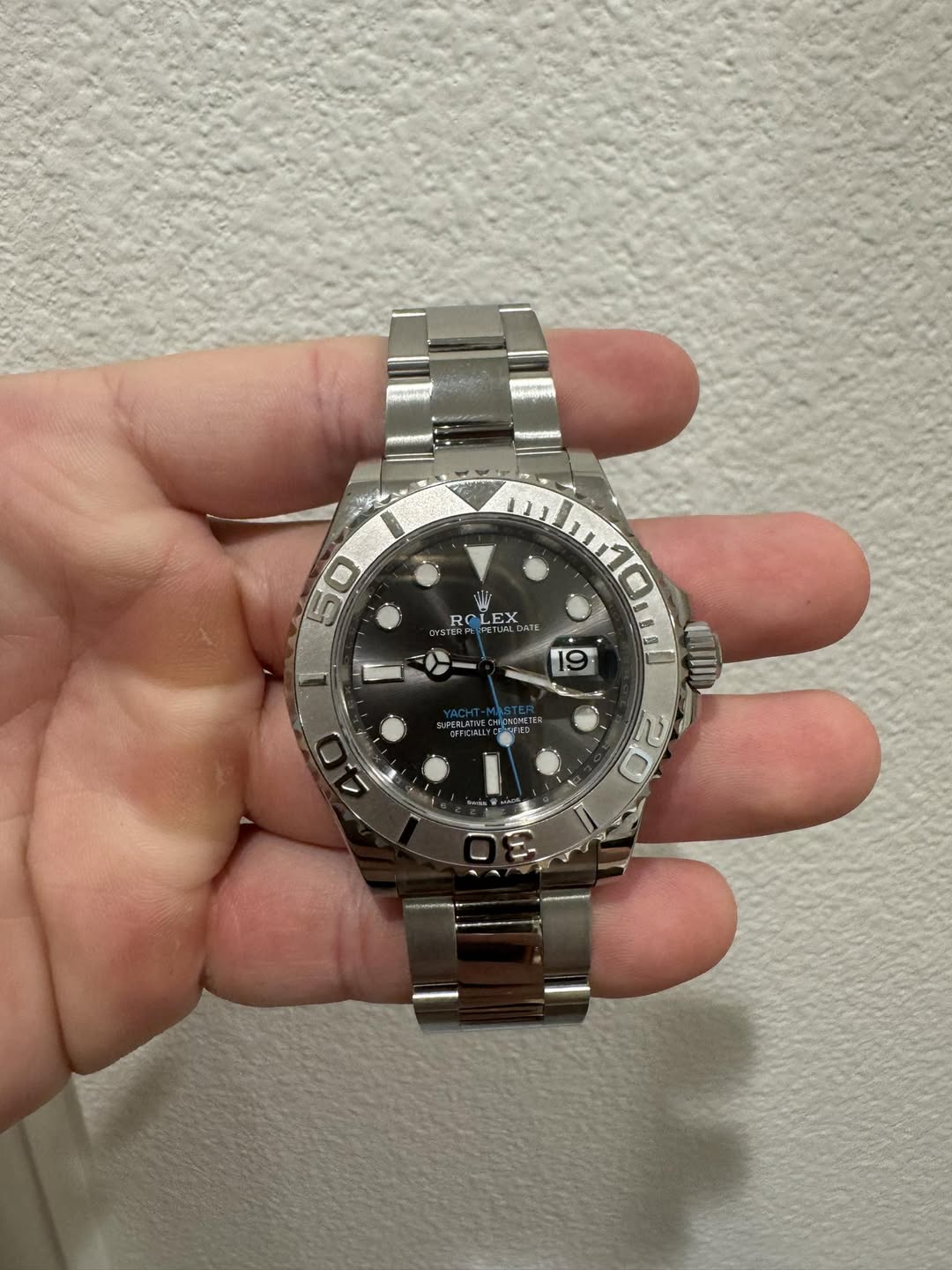 May be an image of wrist watch and text