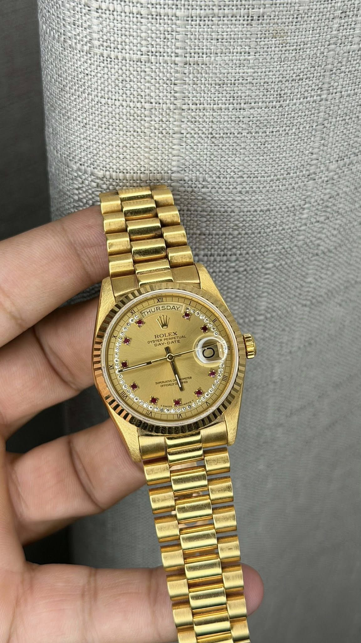 May be an image of wrist watch and text