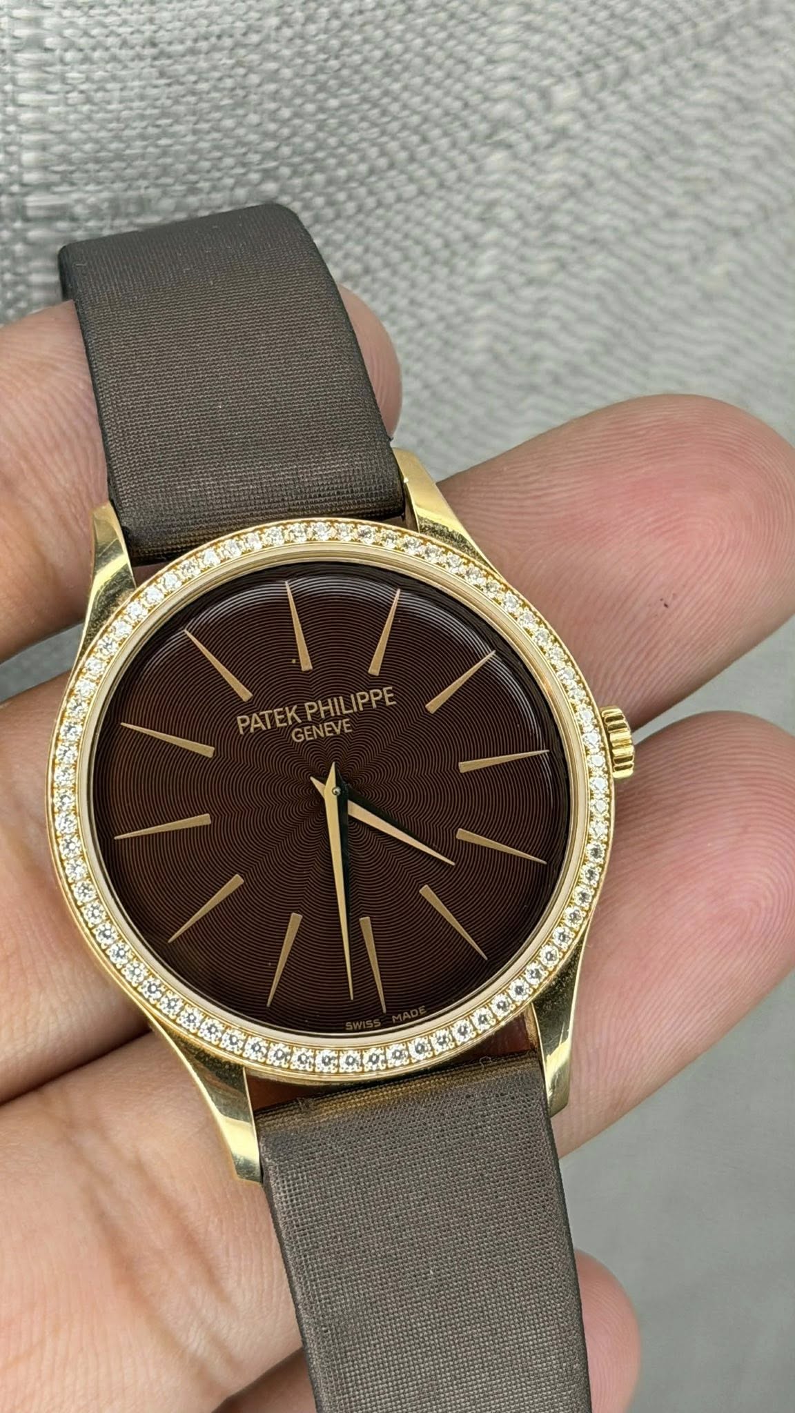 May be an image of wrist watch and text that says 'PATEKPHILIPPE EVE PATEK PHILIP ILIPPE GENEVE'