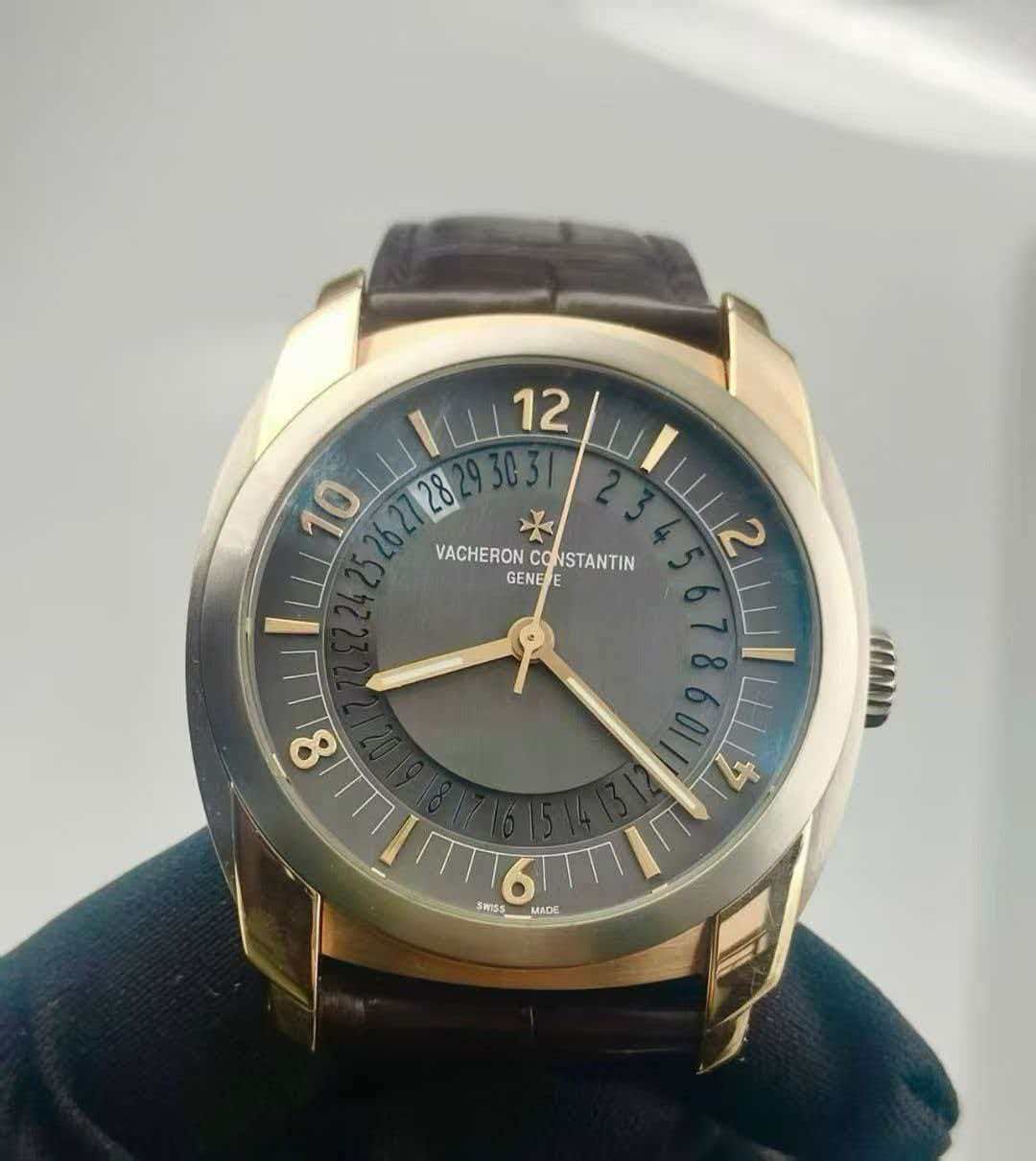 May be an image of wrist watch and text