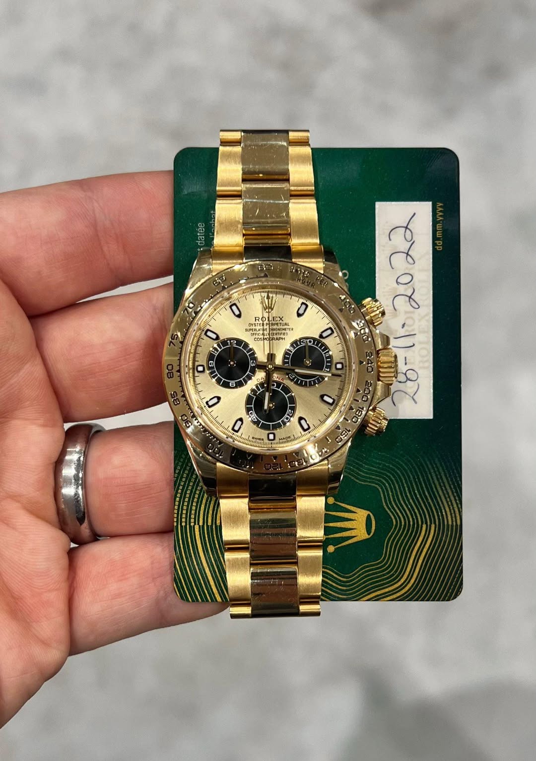 May be an image of wrist watch and text