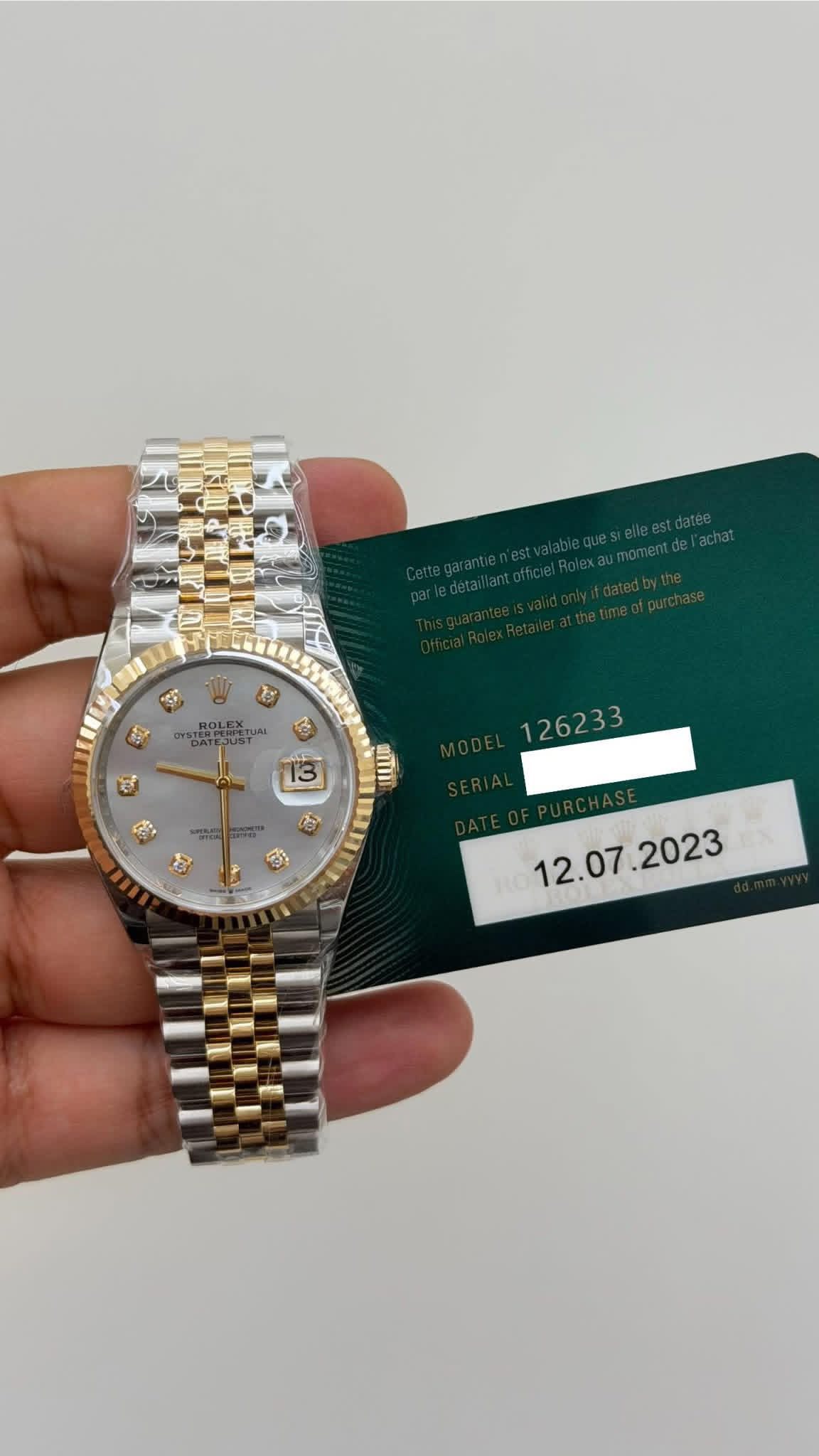 May be an image of wrist watch and text