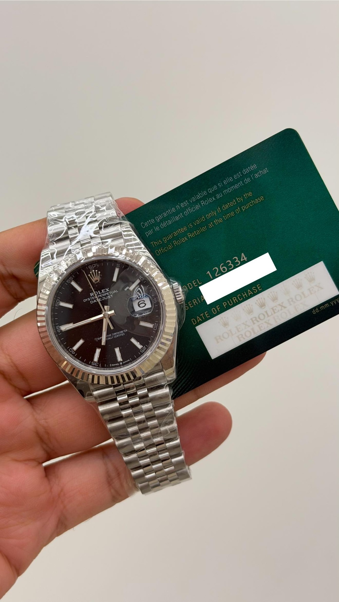 May be an image of wrist watch and text that says 'G O 6 ر 日 26334 TROLEXROLEA ROLEEX ROLEX ROL ROLEXROLEXROLEX ROI'