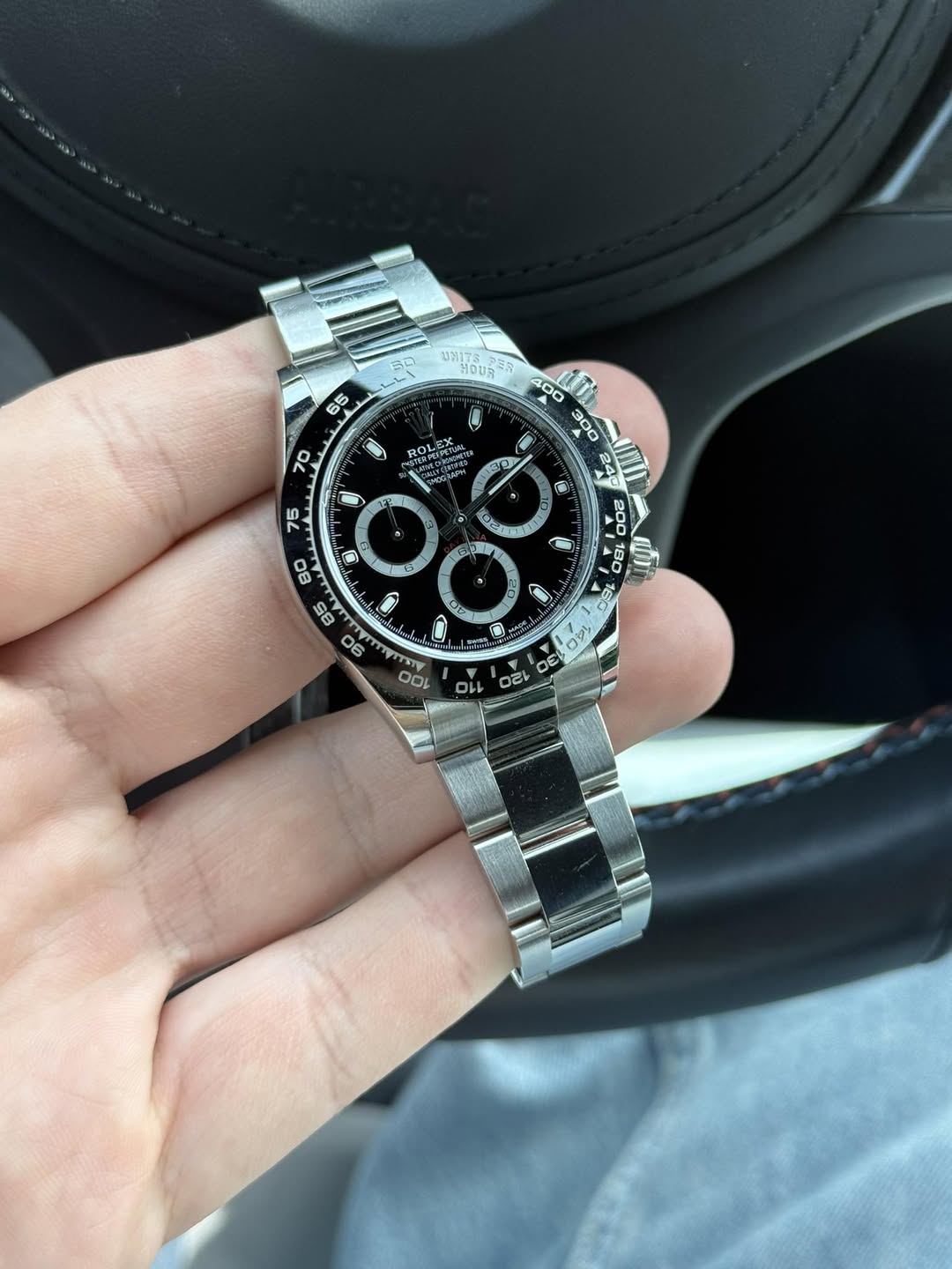 May be an image of wrist watch and text