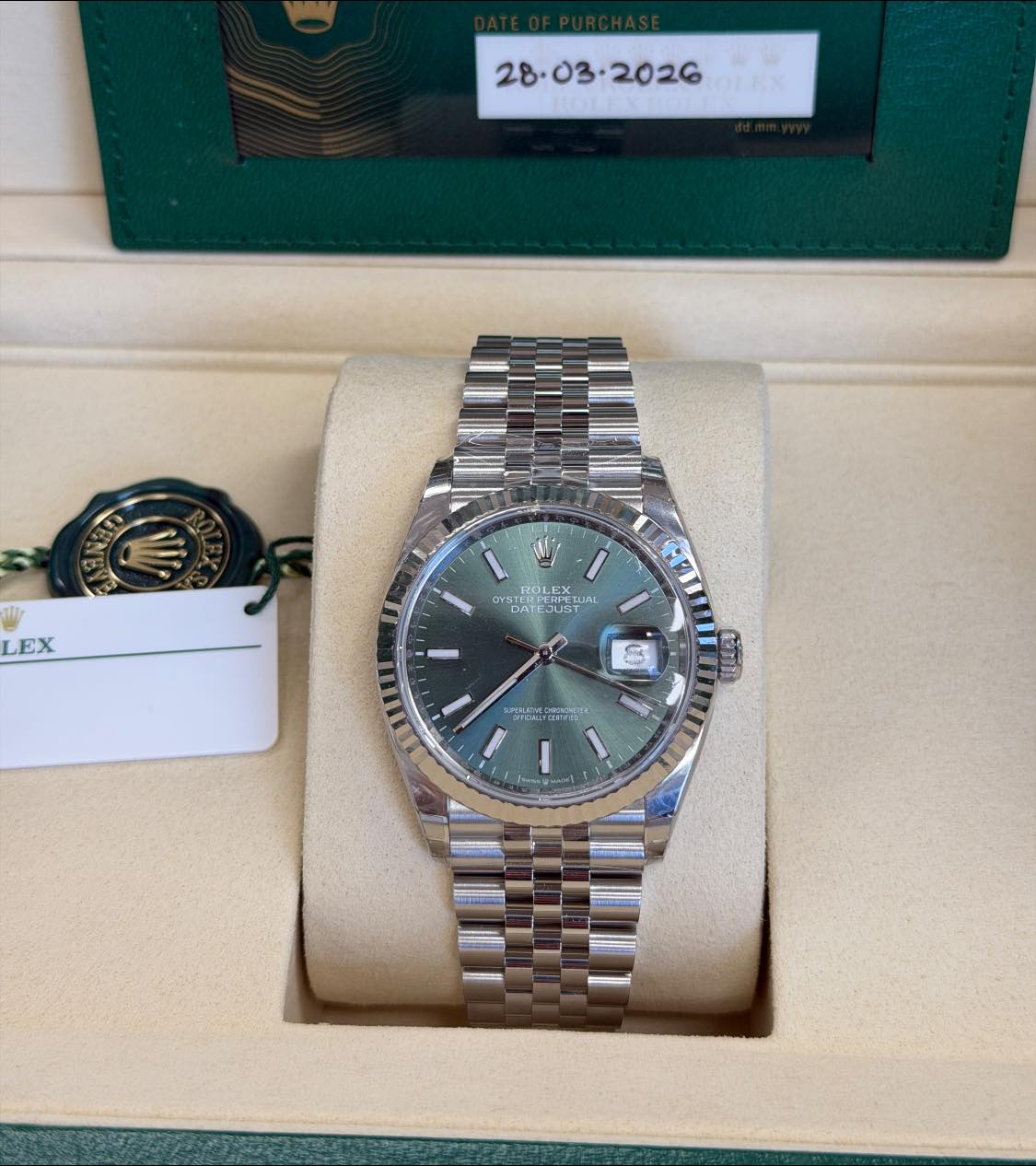 May be an image of wrist watch and text