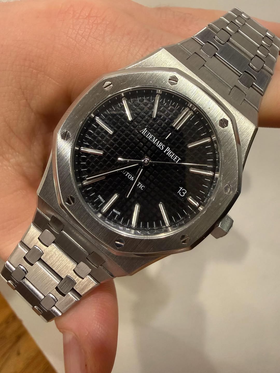 May be an image of wrist watch and text