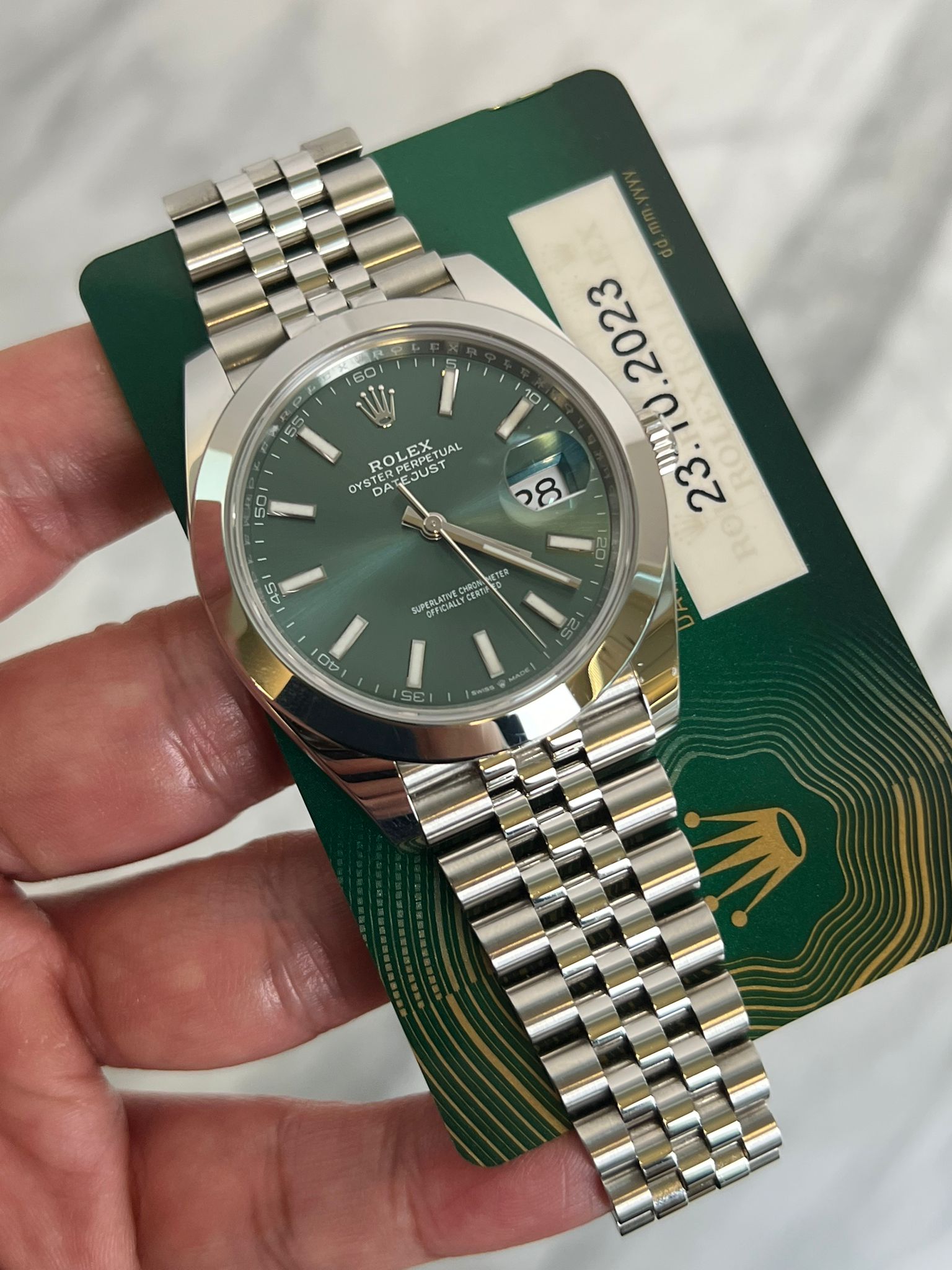 May be an image of wrist watch and text