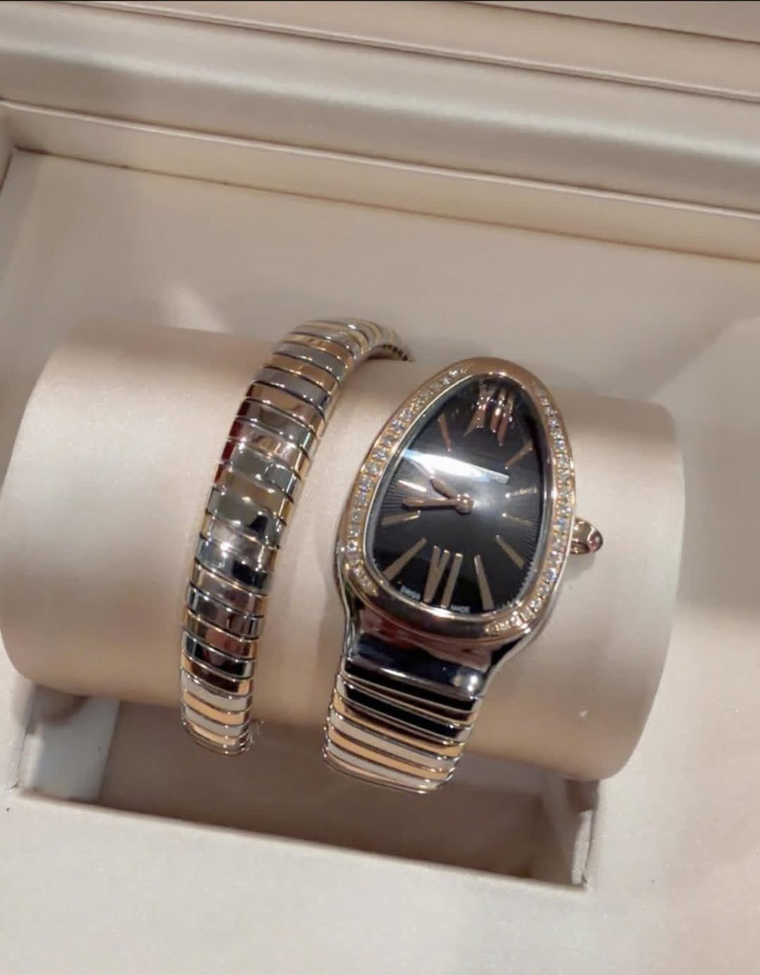 May be an image of wrist watch and jewelry
