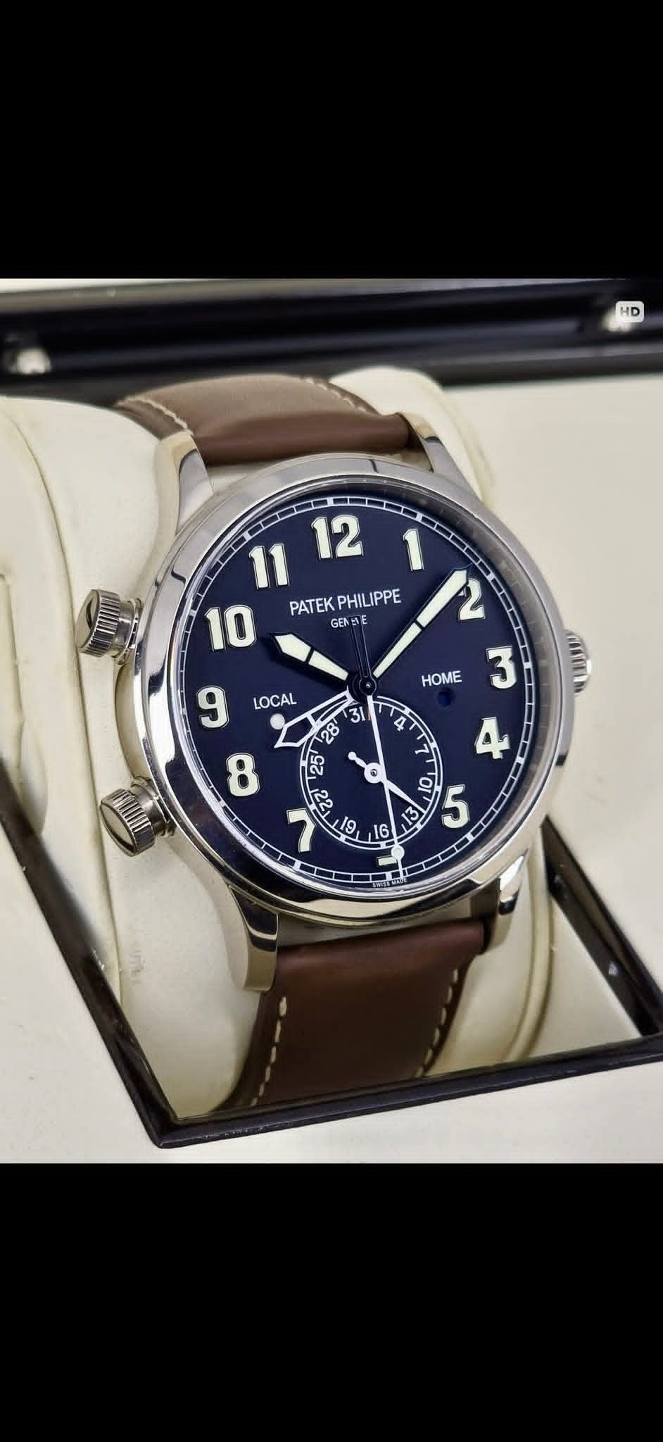 May be an image of wrist watch and text that says 'HD 11 12 10 PATEKPHILIPPE PATEK PHILIPPE GENE 12 3 LOCAL HOME ٢ د Τα LS'