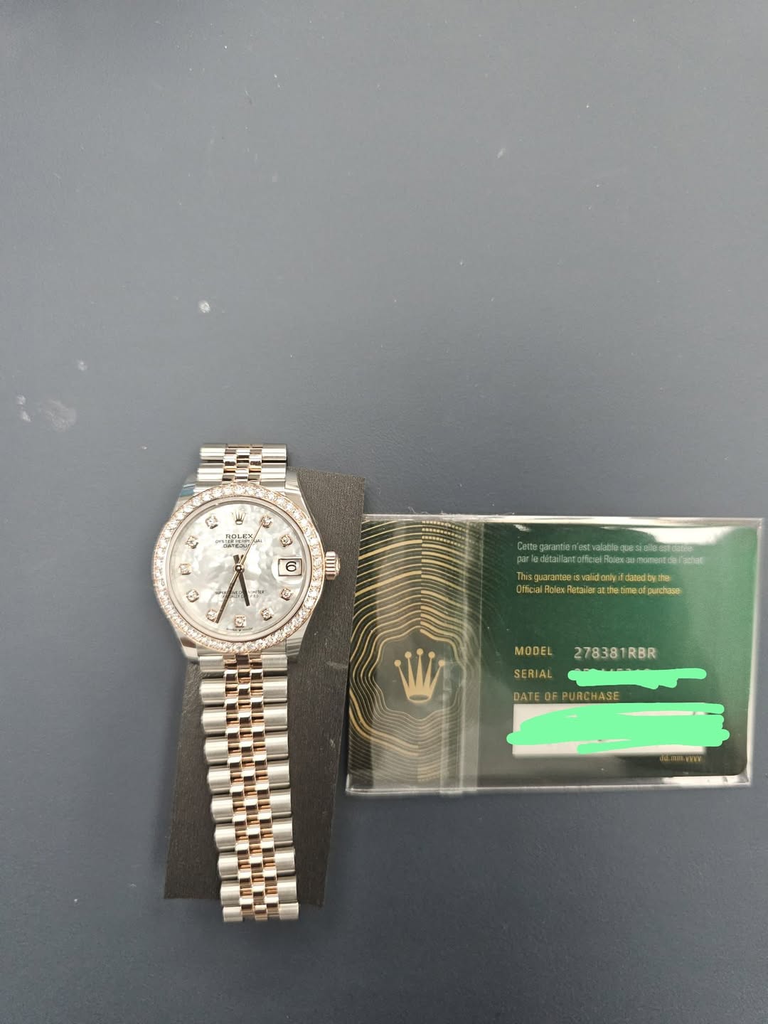 May be an image of wrist watch and text