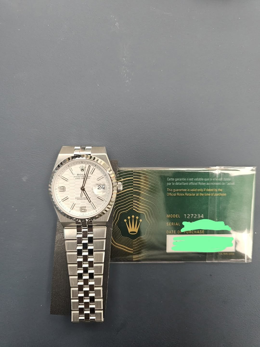May be an image of wrist watch and text