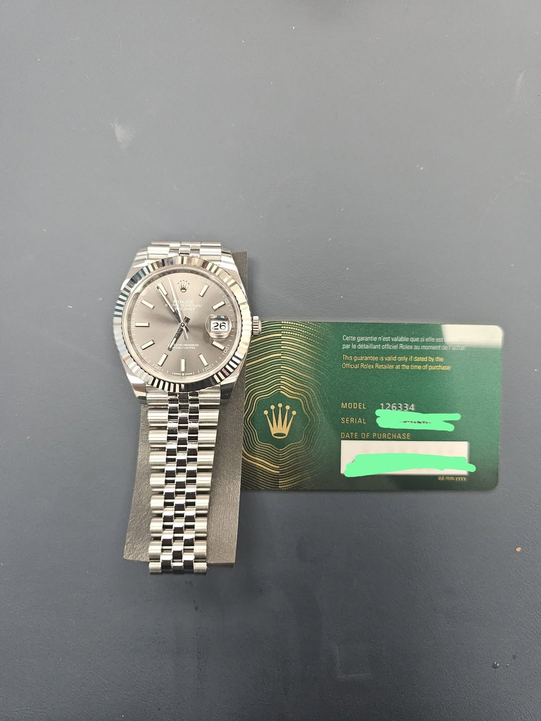 May be an image of wrist watch and text