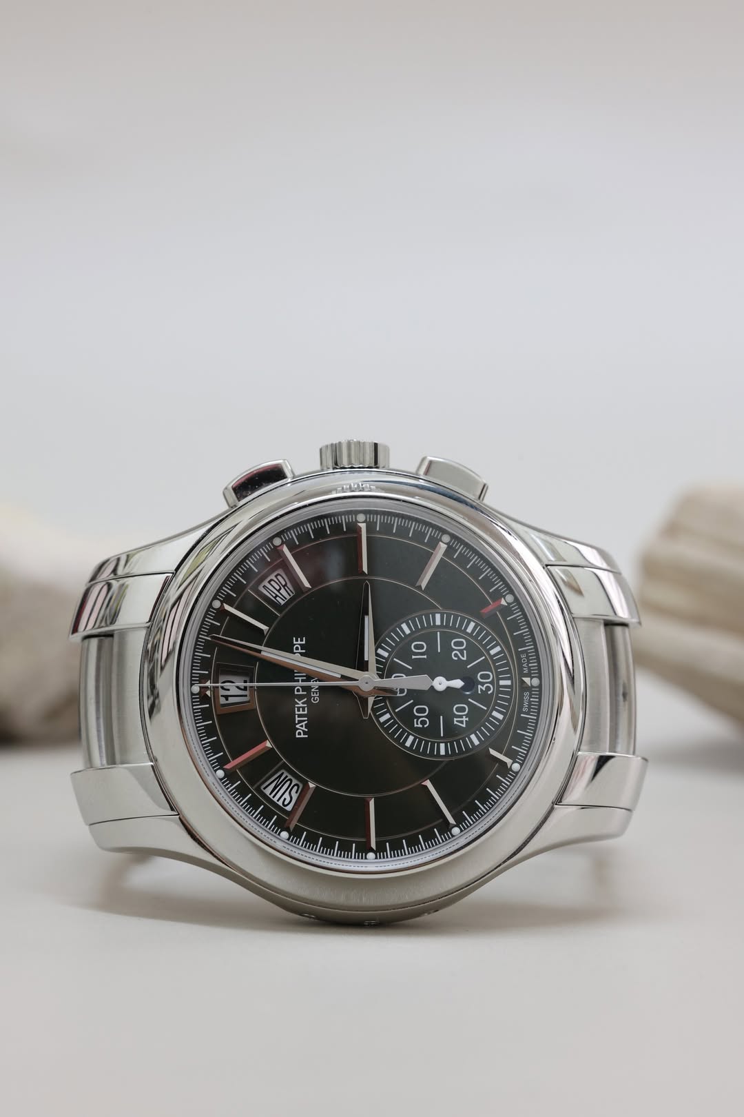 May be an image of wrist watch and text