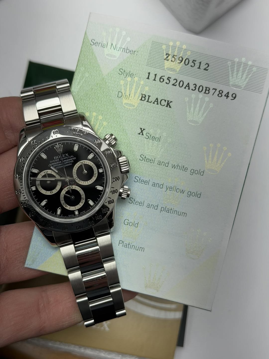 May be an image of wrist watch and text that says 'Serial Number: Number Style: Z590512 7590512 Dial BLACK 116520A307849 116520A30B7849 60 • 65 ماطن 10lO y XSteel 0 2N LIEL T…