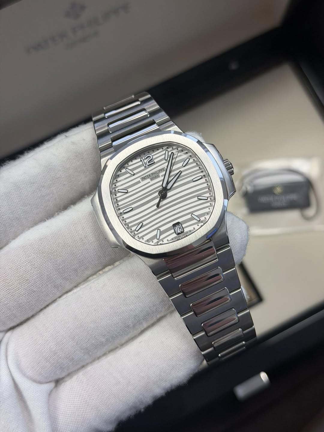 May be an image of wrist watch and text