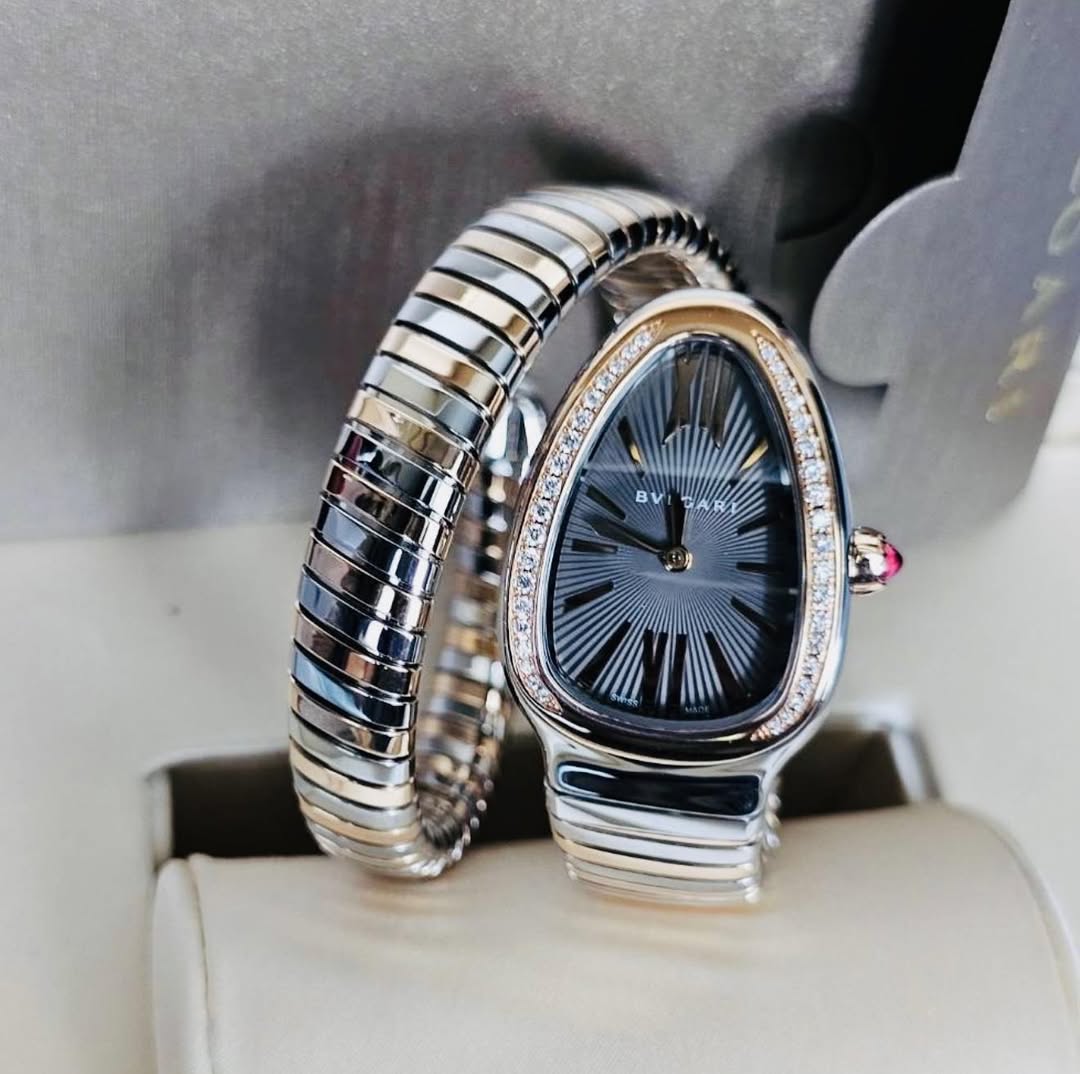 May be an image of digital watch, jewelry and text that says 'BV'