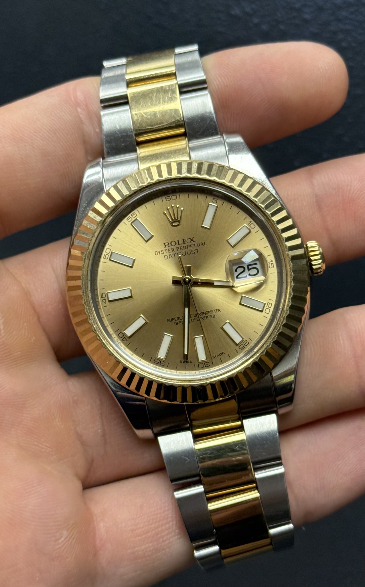 May be an image of wrist watch and text that says '60 W 55 RO OYS DAT OYSTER 50 I I በ 10 25 15 ወበ 45 I ETER Qi 20 C'