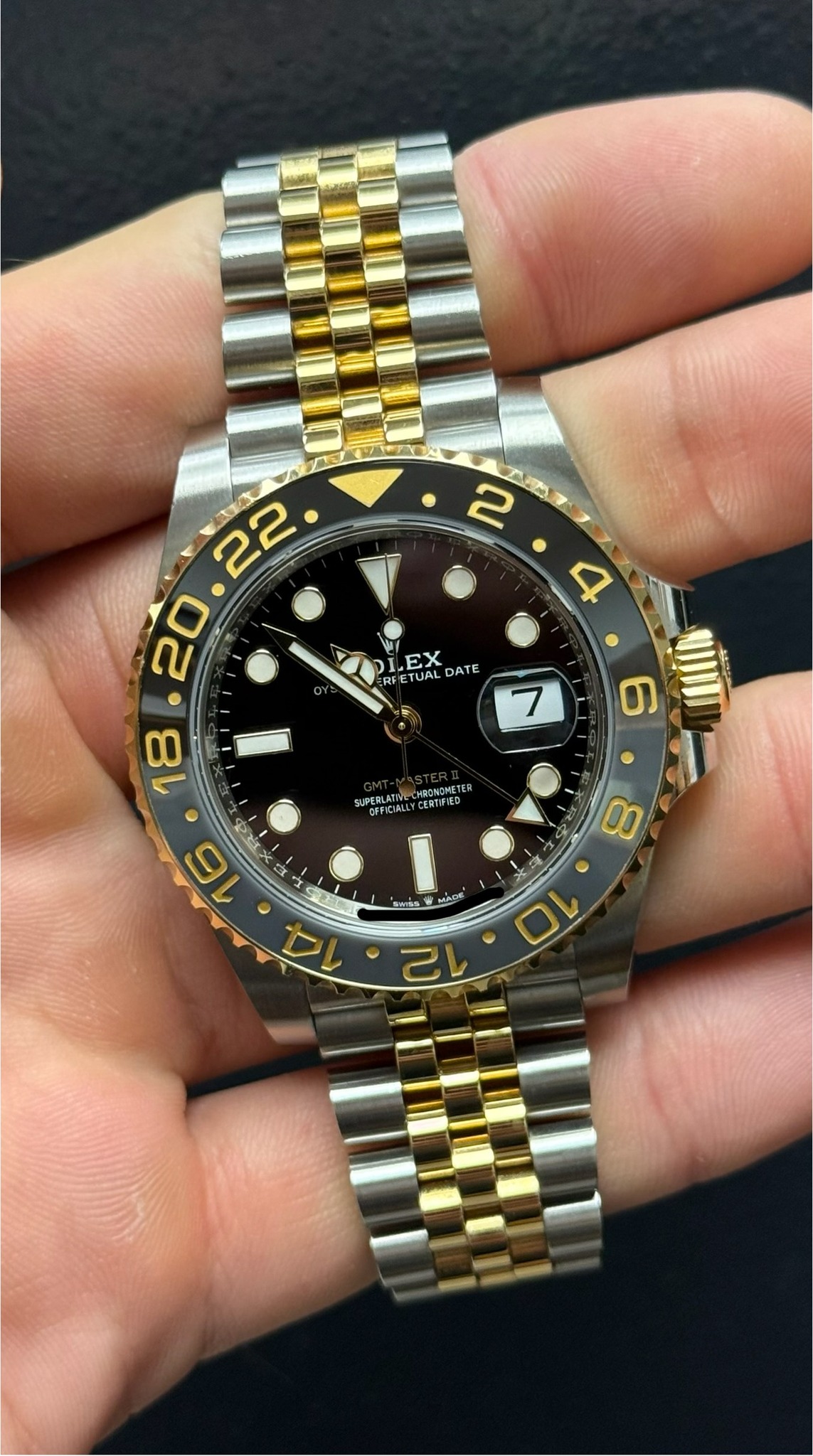 May be an image of wrist watch and text