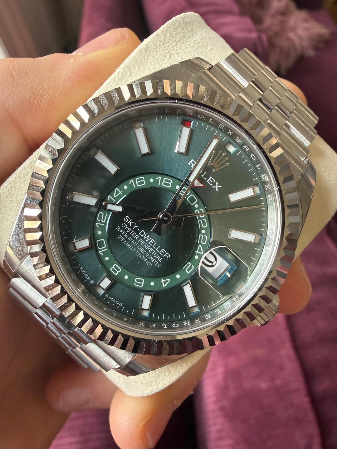 May be an image of wrist watch and text
