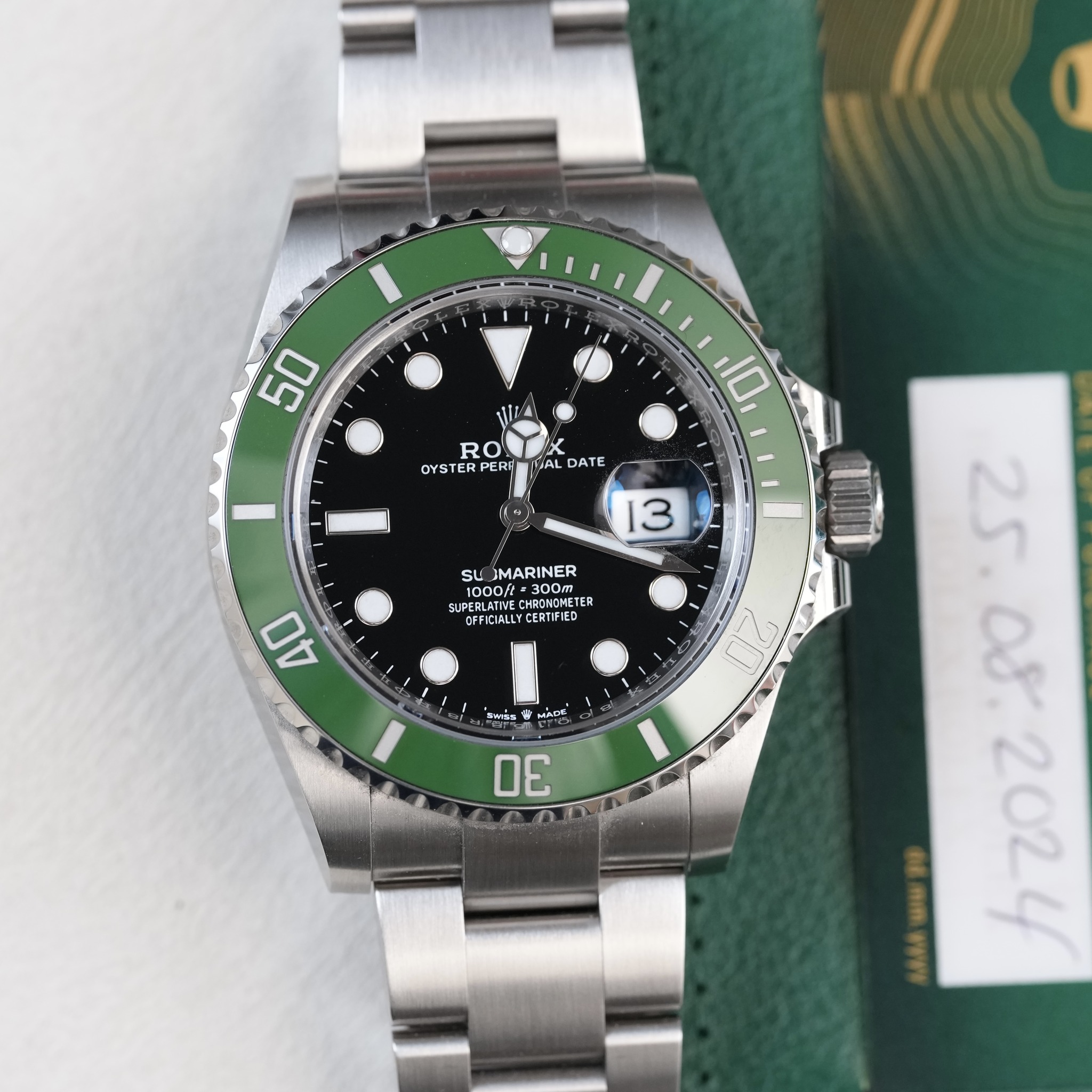 May be an image of wrist watch and text that says '50 RO OYSTE OYSTERPER RPERS K UAL DATE 10 13 su JMARINER 1000 A6OKAИE -300T 300m TER N SUPERLATWE SUPE O CHROKOM OFFICIGLLY…