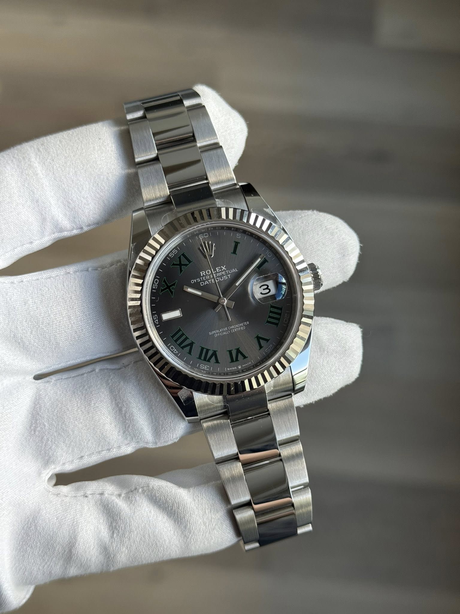 May be an image of wrist watch and text