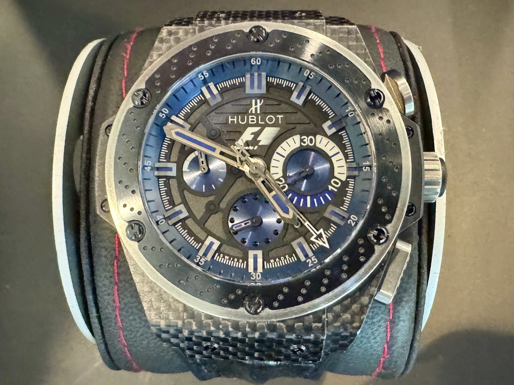 May be an image of wrist watch and text