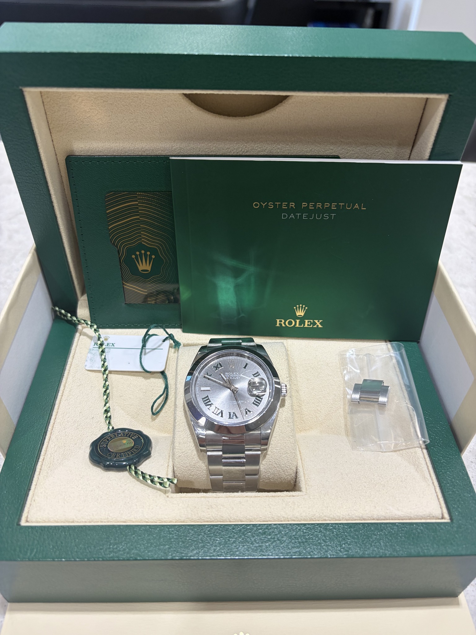 May be an image of wrist watch and text