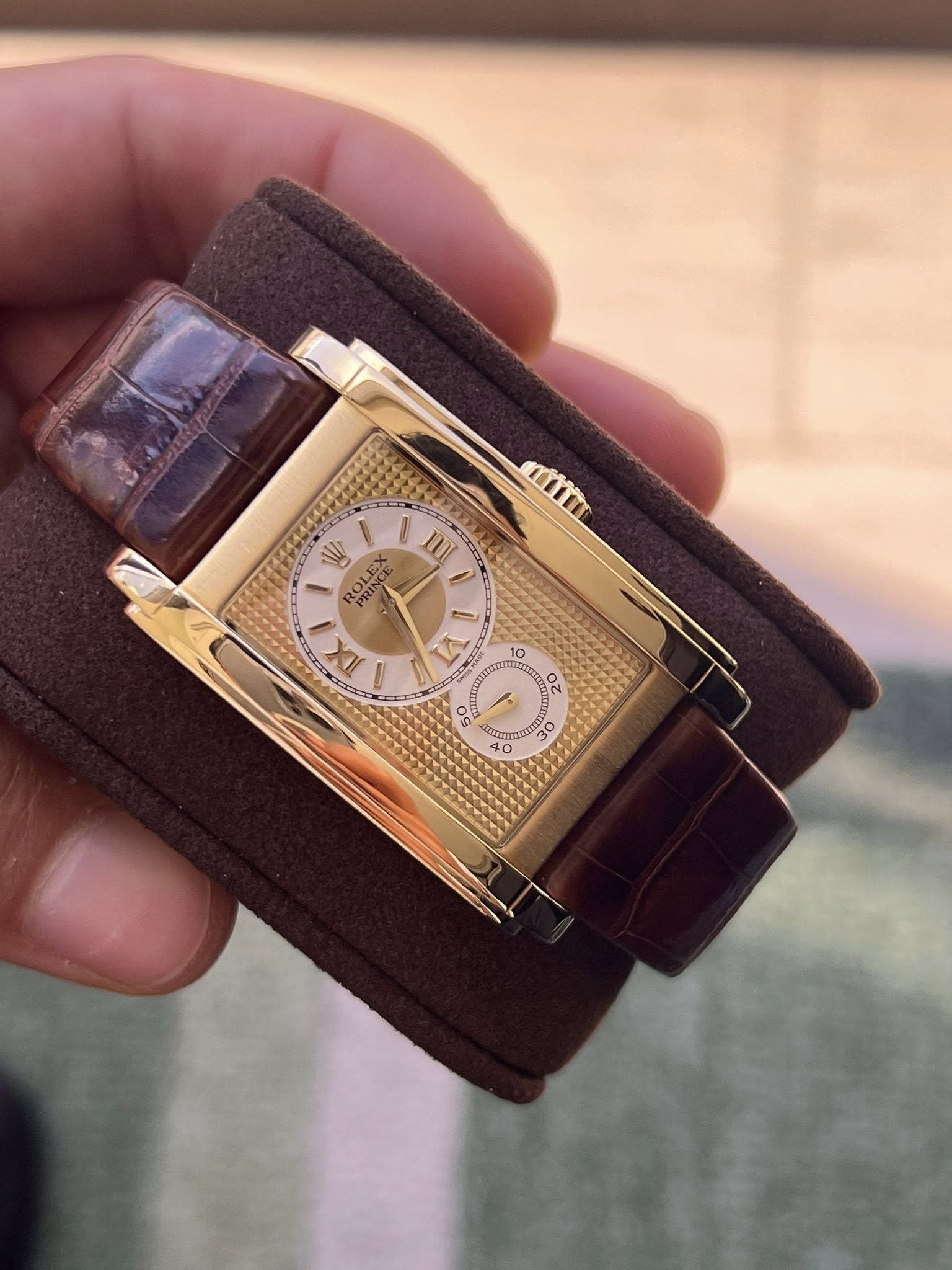 May be an image of wrist watch and text