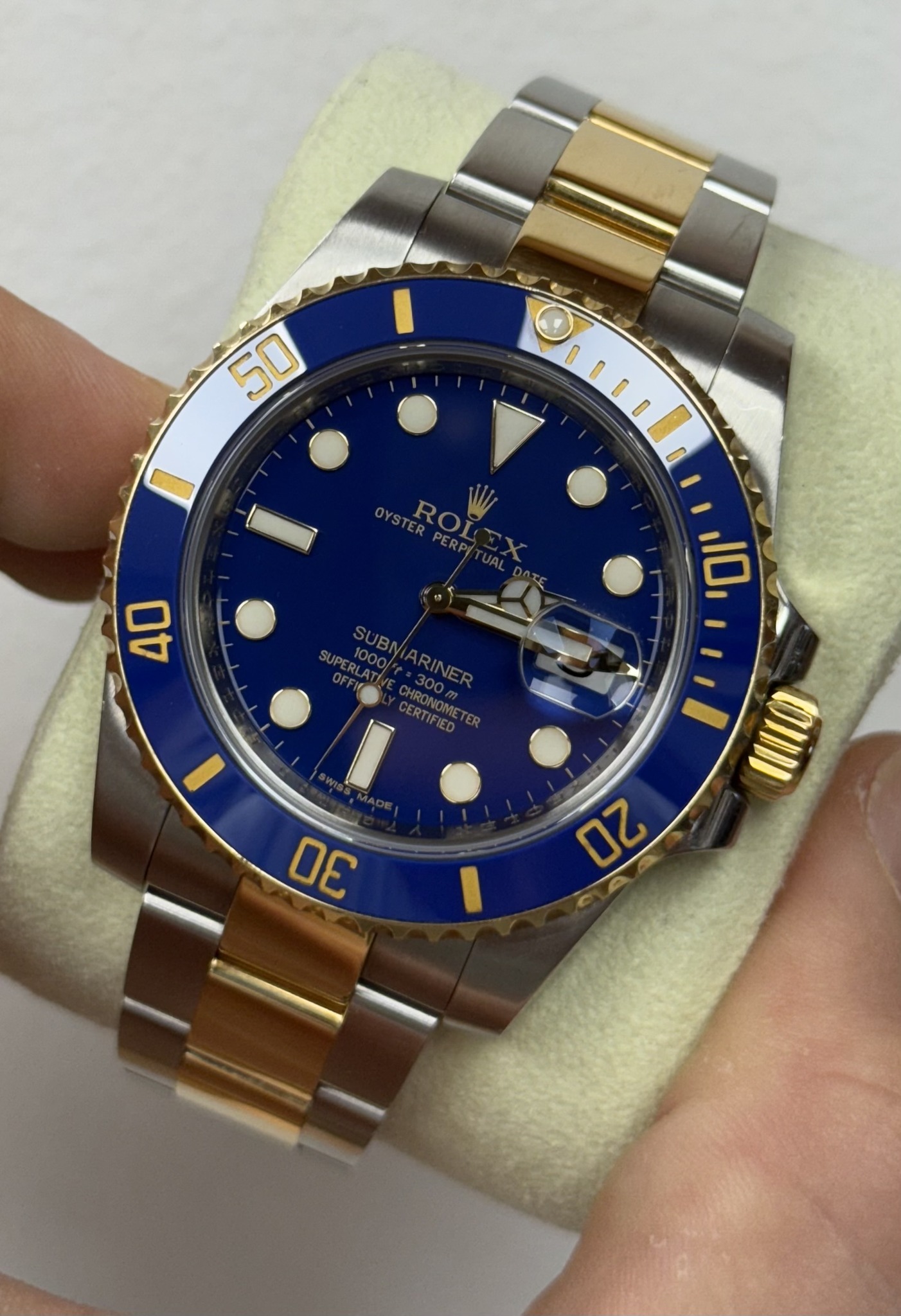 May be an image of wrist watch and text that says '50 I OYSTER ROL HIIO 10 40 SUBN 1000 I DE 1 ባሪ'