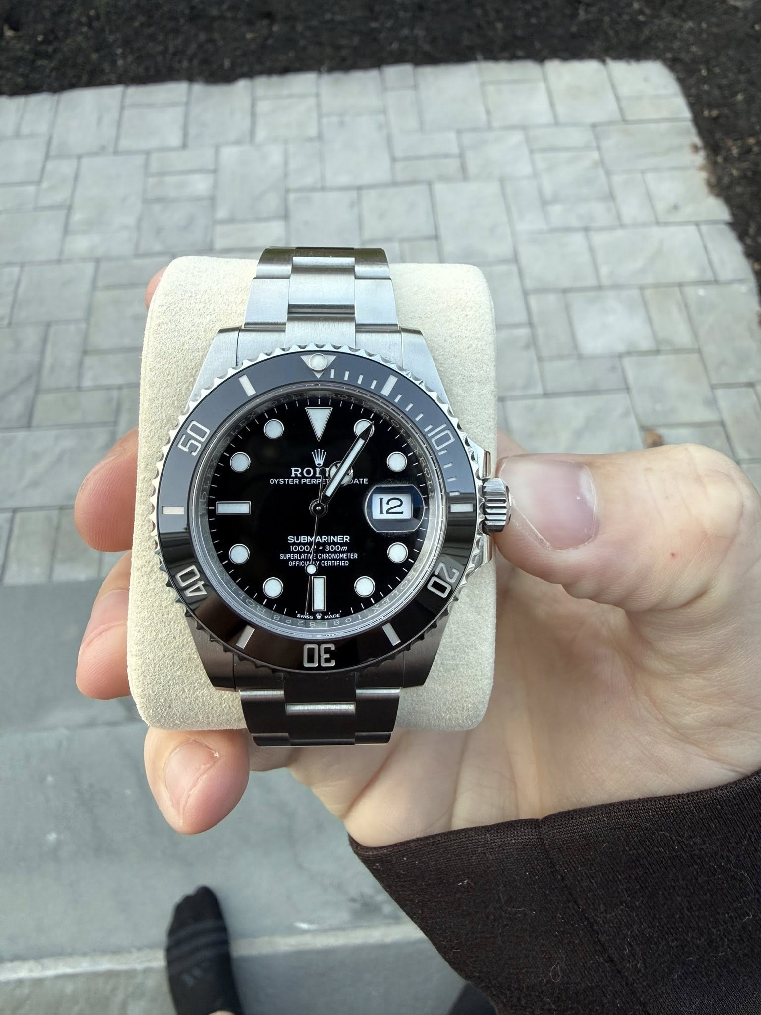 May be an image of wrist watch and text that says '50 ROL お ATE 10 12 SUBMARINER AO 20 30'