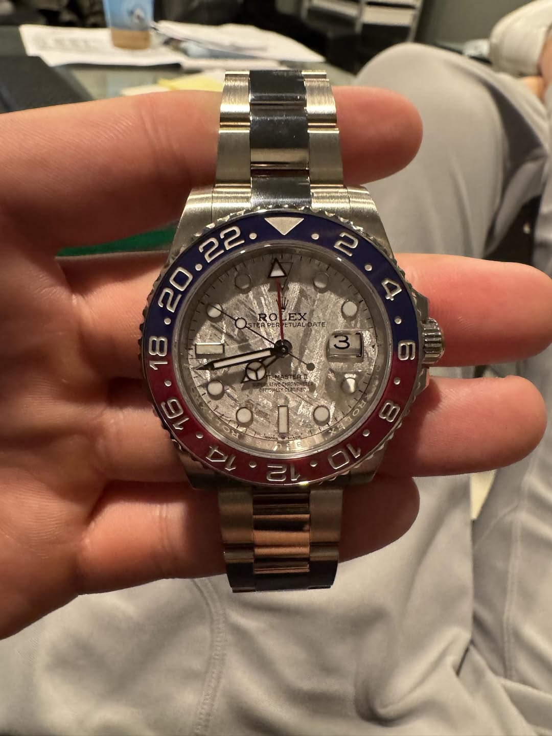 May be an image of wrist watch and text