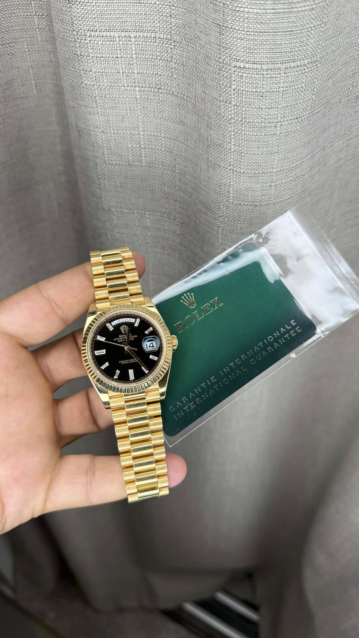 May be an image of wrist watch and text