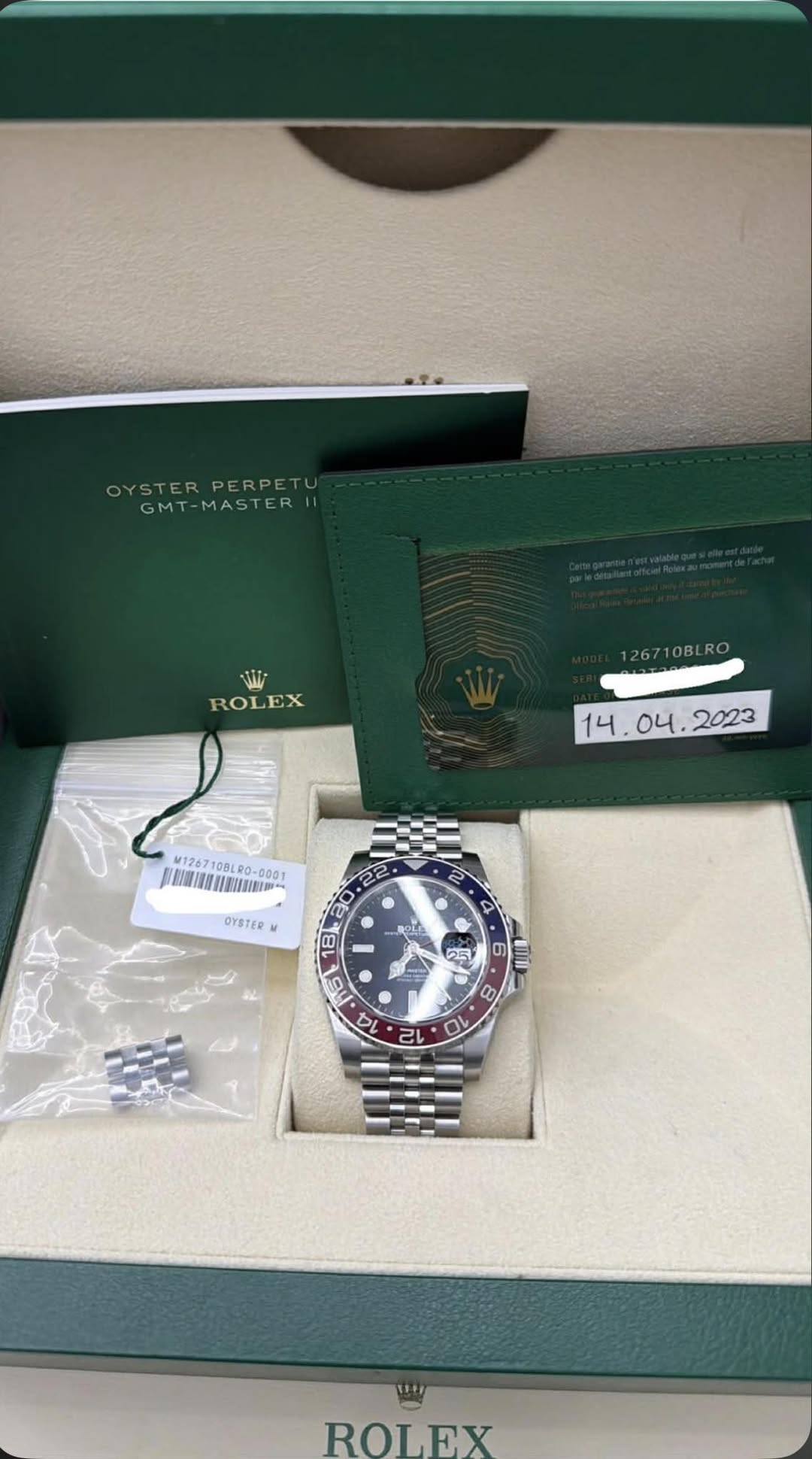 May be an image of wrist watch and text that says 'OYSTERPERPETU OYSTER STERPERPET PERPET GMT-MASTER GMT VIL ROLEX 26710BL . O4. 2023 14. M126710BLR0-6001 90-00g1 PAAOUIBWNEA…