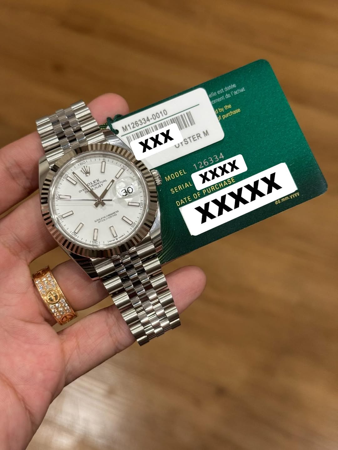 May be an image of wrist watch and text