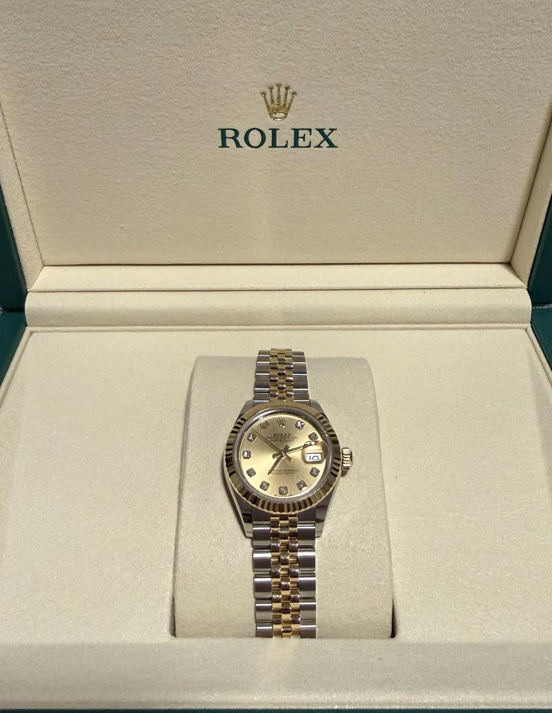 May be an image of wrist watch and text
