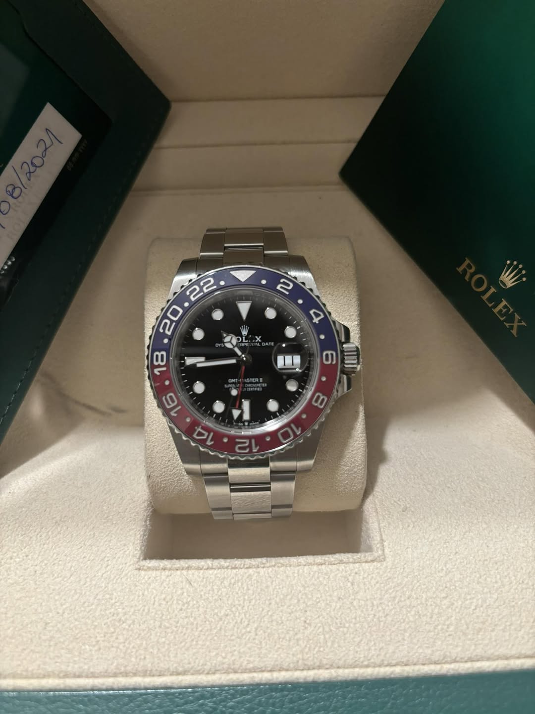 May be an image of wrist watch and text
