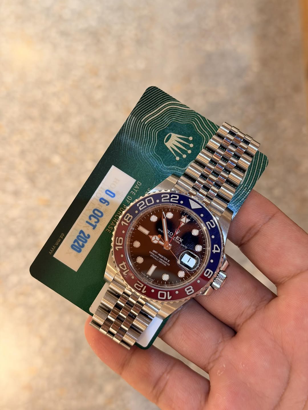 May be an image of wrist watch and text