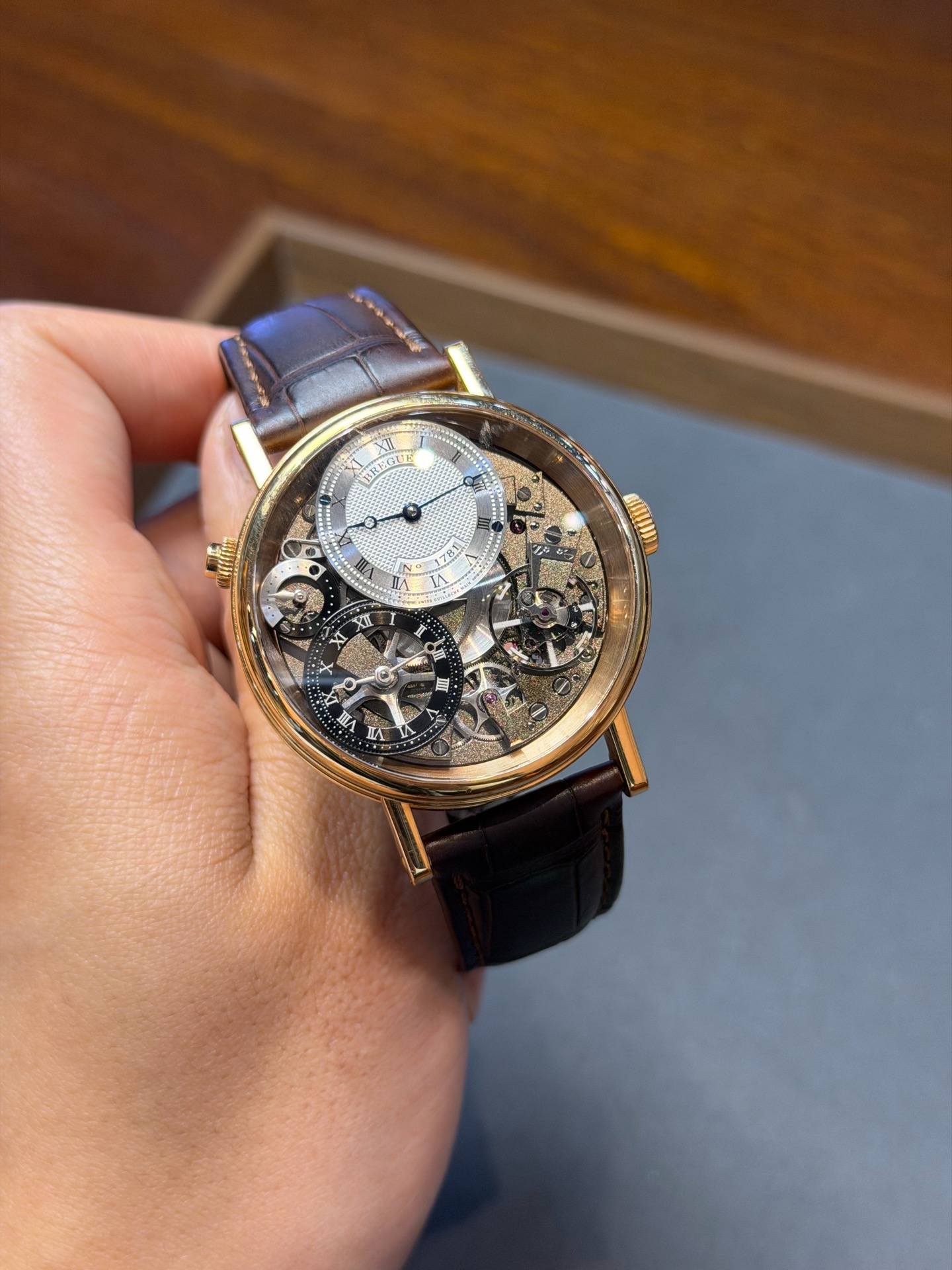 May be an image of wrist watch and text