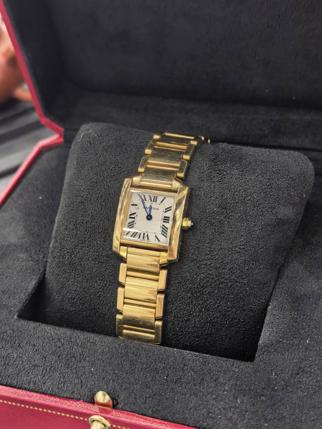 May be an image of wrist watch and text