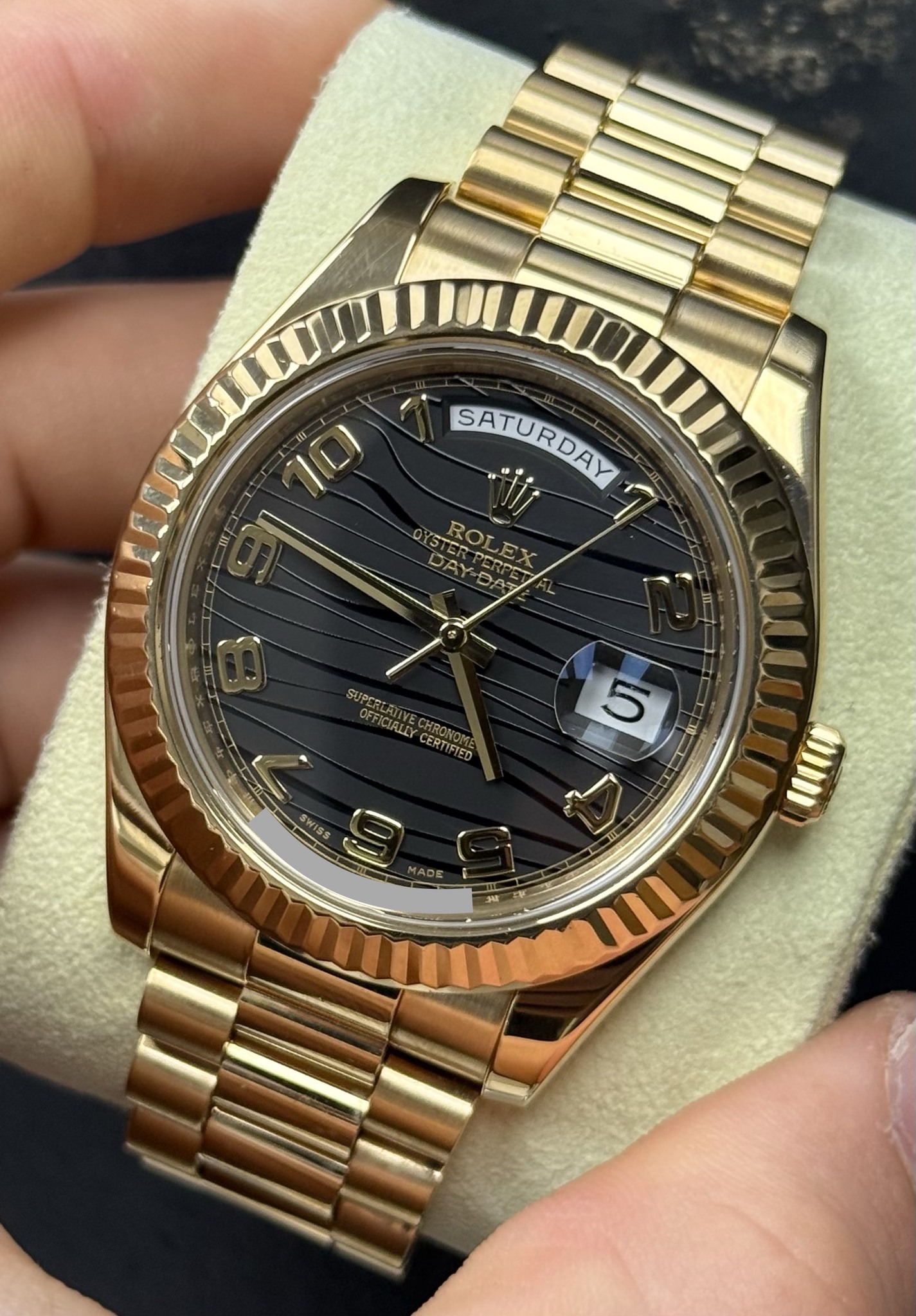 May be an image of wrist watch and text