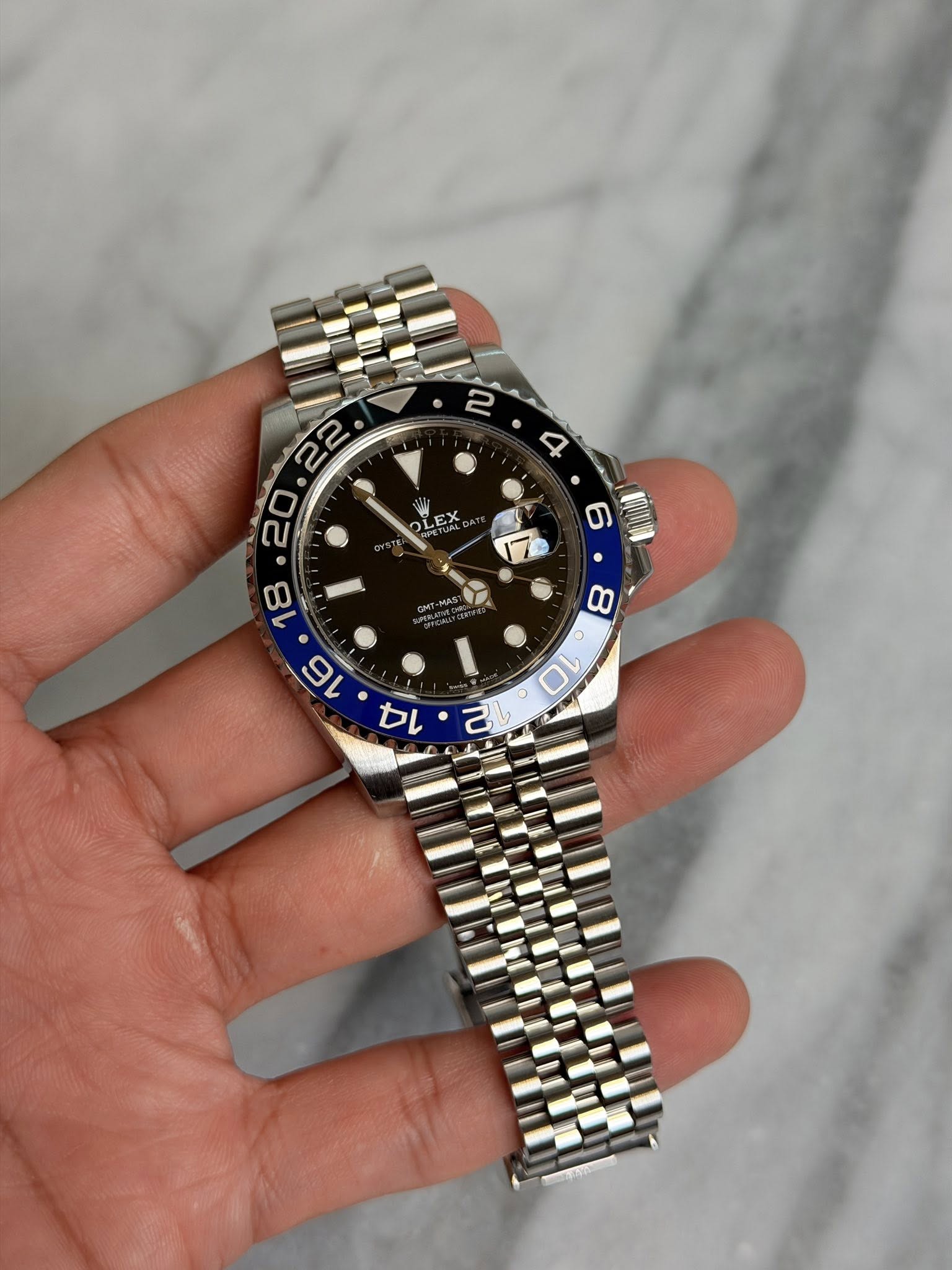 May be an image of wrist watch and text
