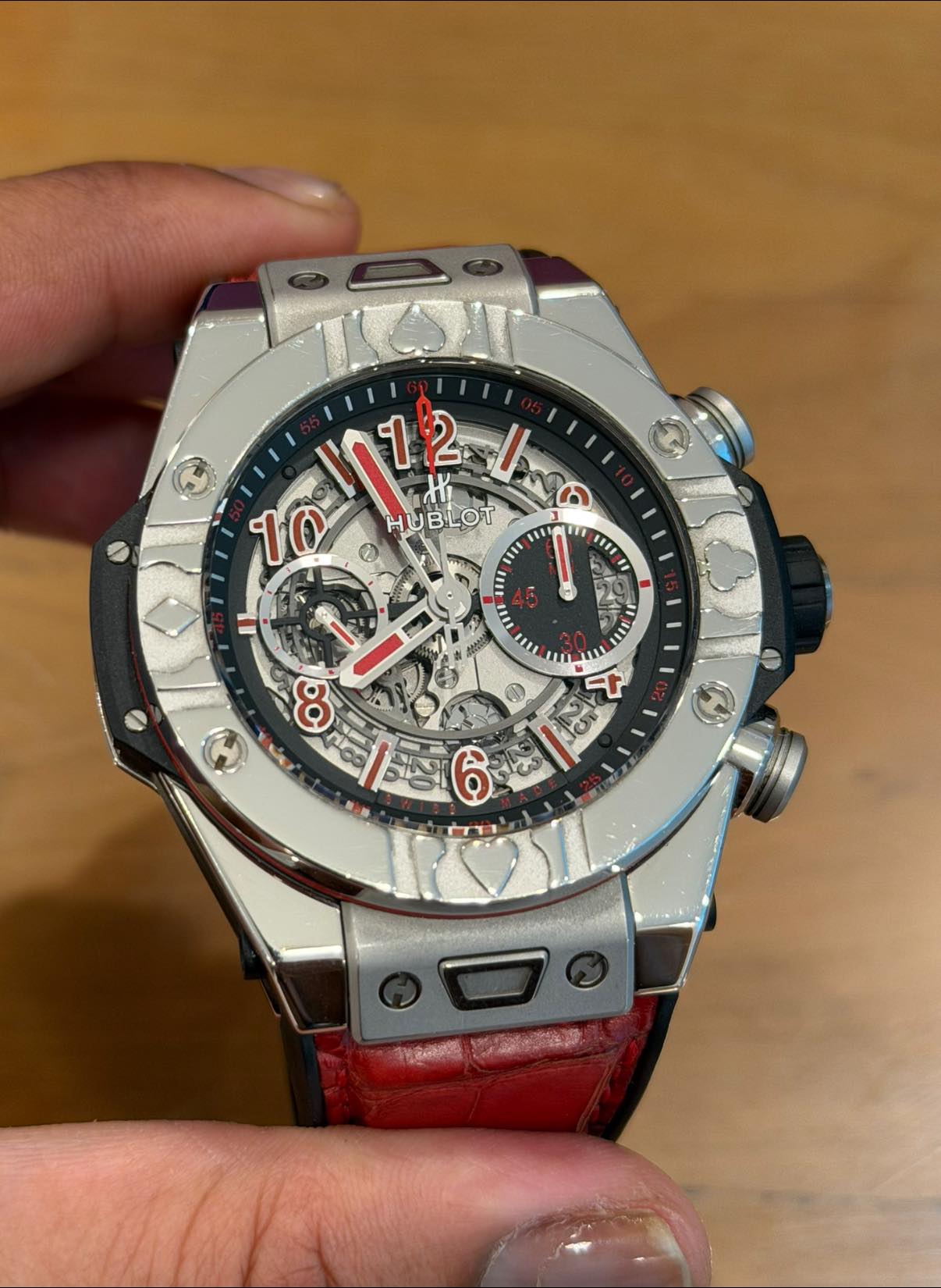 May be an image of wrist watch and text