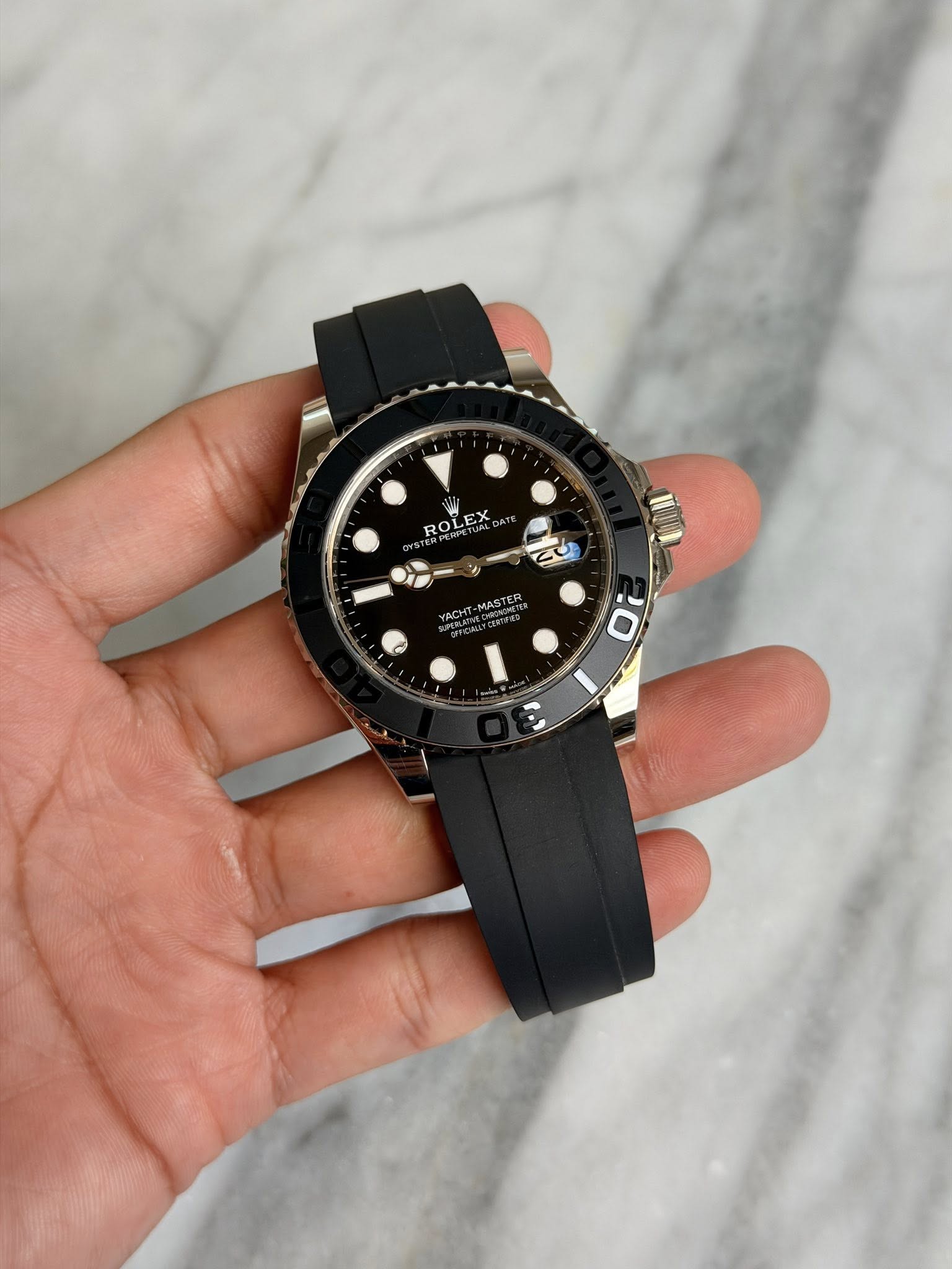 May be an image of wrist watch and text that says 'ROLEX EX ROL YACHT HL MASTER 0'