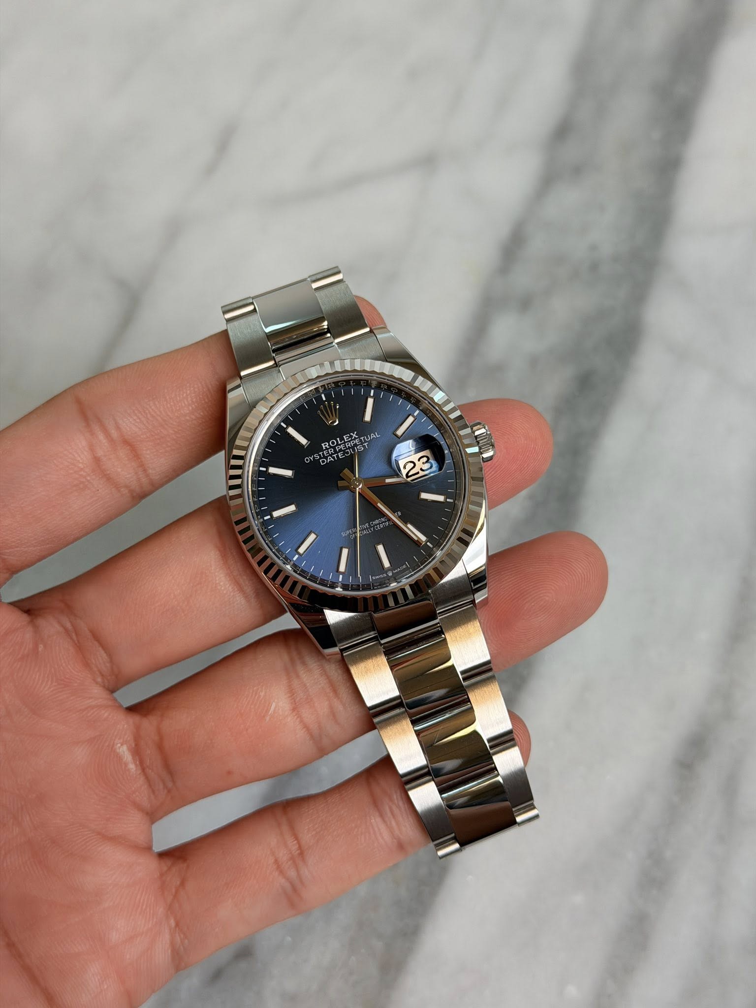 May be an image of wrist watch and text