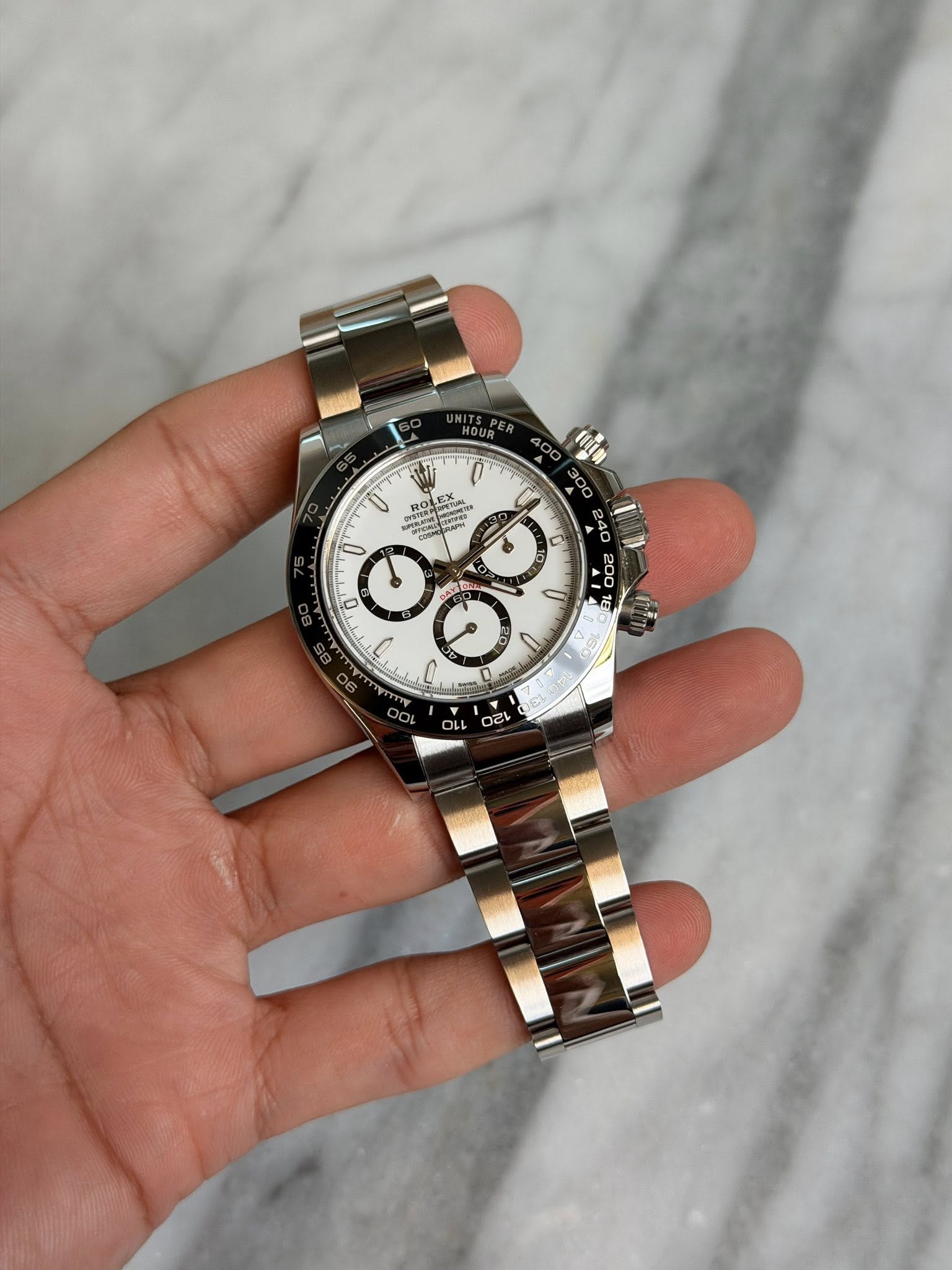 May be an image of wrist watch and text