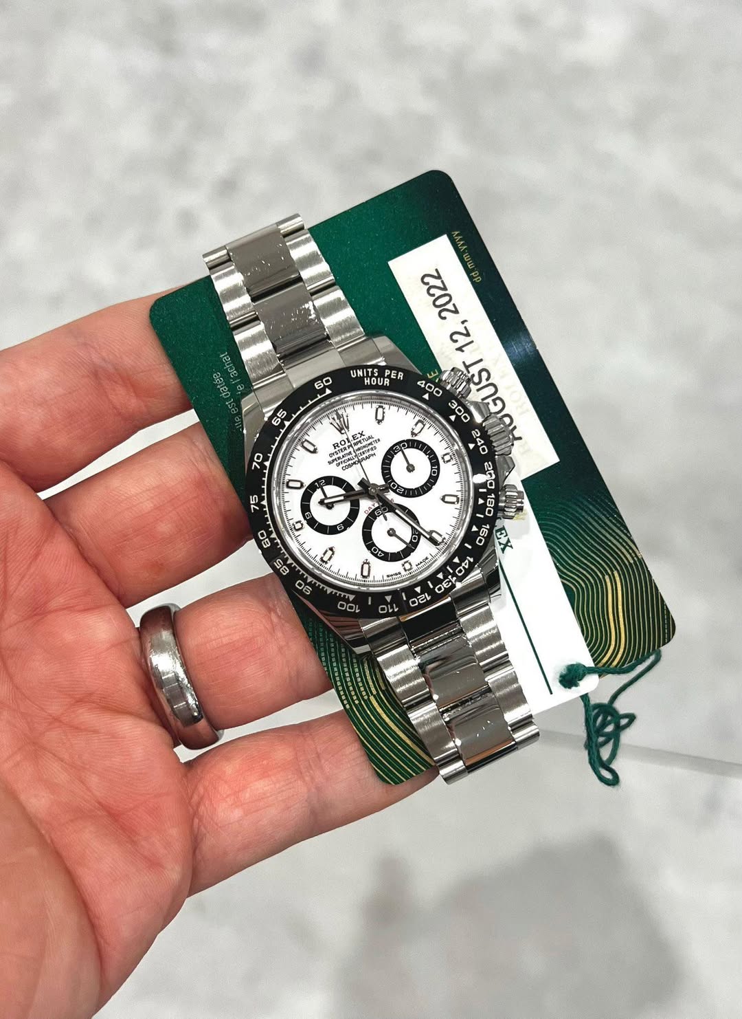May be an image of wrist watch and text