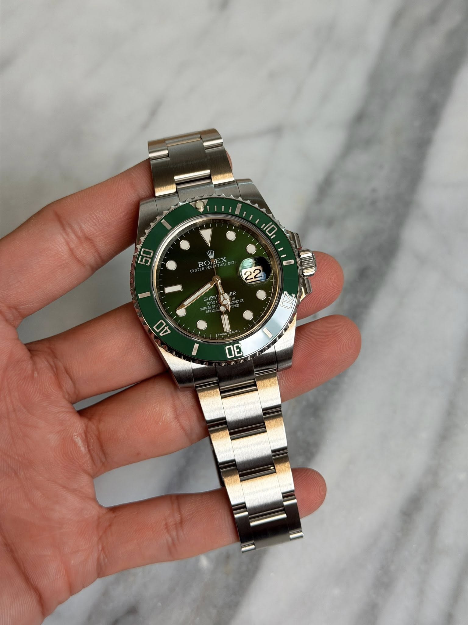 May be an image of wrist watch and text that says '10 50 22 D0'