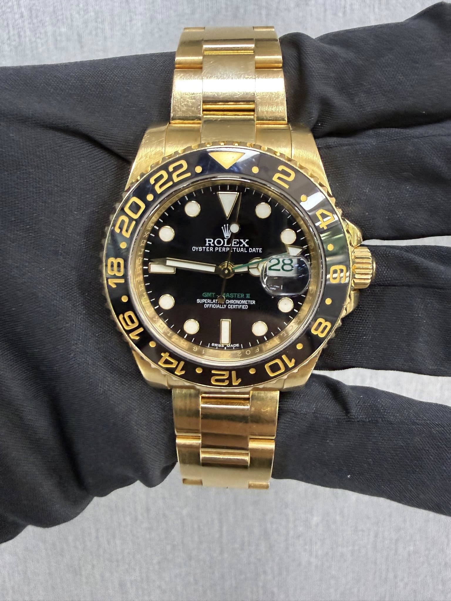 May be an image of wrist watch and text